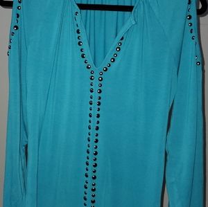 Very pretty and feminine! This is a turquoise cold shoulder dress shirt